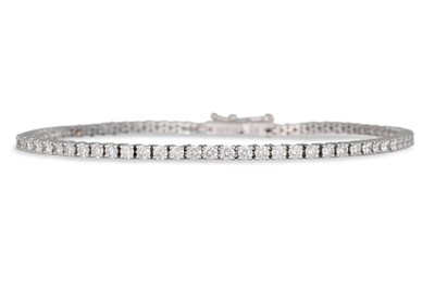Lot 206 - A DIAMOND LINE BRACELET, the brilliant cut...