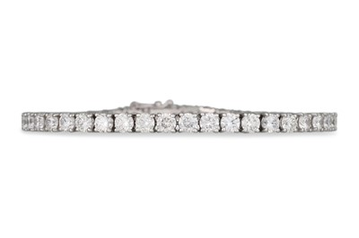 Lot 207 - A DIAMOND LINE BRACELET, the brilliant cut...