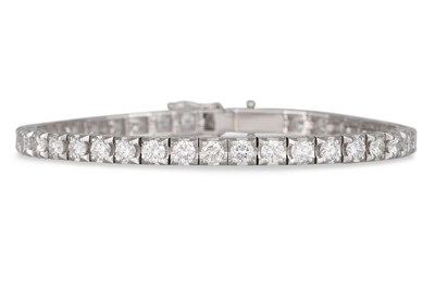 Lot 208 - A DIAMOND LINE BRACELET, the brilliant cut...