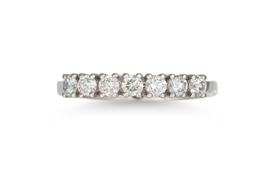 Lot 314 - A SEVEN STONE DIAMOND RING, the brilliant cut...