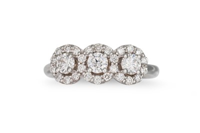 Lot 260 - A DIAMOND TRIPLE CLUSTER RING, the brilliant...