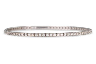 Lot 53 - A DIAMOND LINE BRACELET, the brilliant cut...