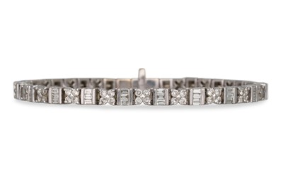 Lot 377 - A DIAMOND LINE BRACELET, set with baguette and...