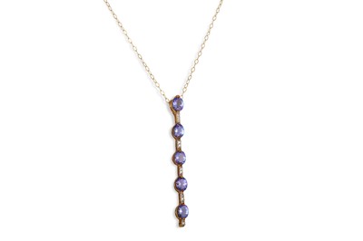Lot 171 - A TANZANITE AND DIAMOND PENDANT, mounted in...