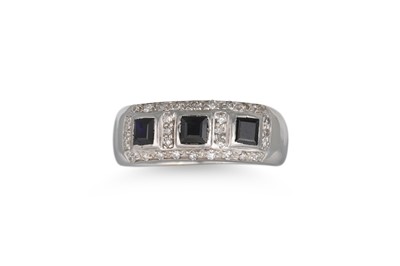 Lot 186 - A SAPPHIRE AND DIAMOND RING, the three central...