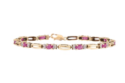 Lot 152 - A DIAMOND AND RUBY CLUSTER BRACELET, mounted...
