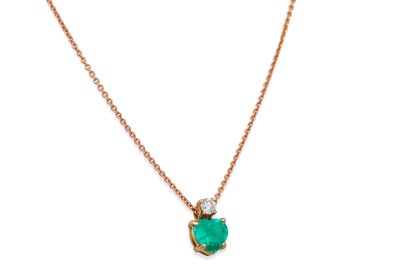 Lot 367 - AN EMERALD AND DIAMOND PENDANT, set with a...