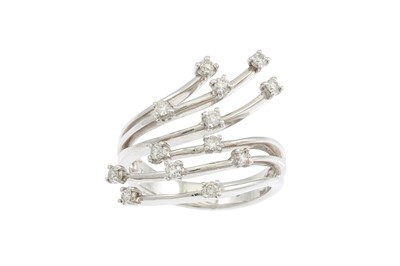 Lot 184 - A DIAMOND CROSS OVER DRESS RING, set with...