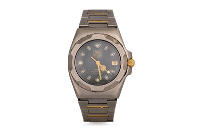 Lot 411 - A GENT'S TAG HEUER TITANIUM QUARTZ WRISTWATCH,...