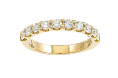 Lot 187 - A DIAMOND HALF ETERNITY RING, the brilliant...