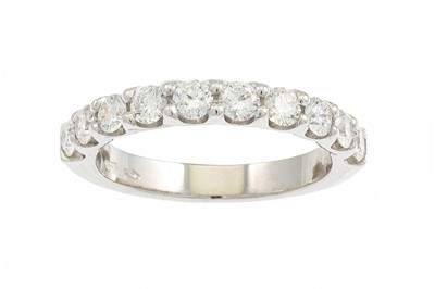 Lot 190 - A DIAMOND HALF ETERNITY RING, the brilliant...