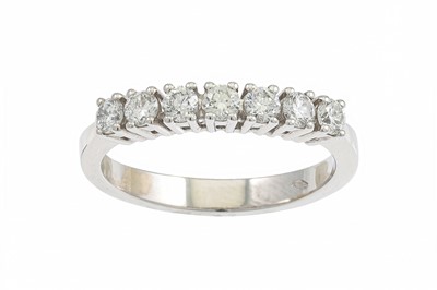 Lot 191 - A DIAMOND SEVEN STONE RING, the brilliant cut...