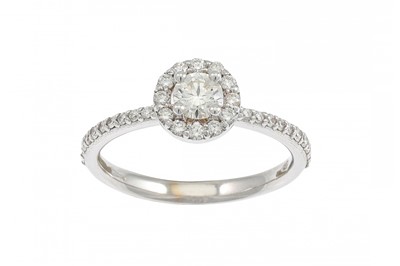 Lot 193 - A DIAMOND 'HALO' CLUSTER RING, the brilliant...