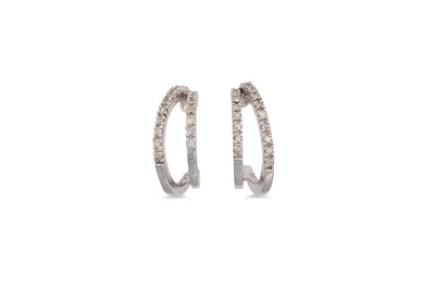 Lot 50 - A PAIR OF DIAMOND HOOP EARRINGS, of circular...