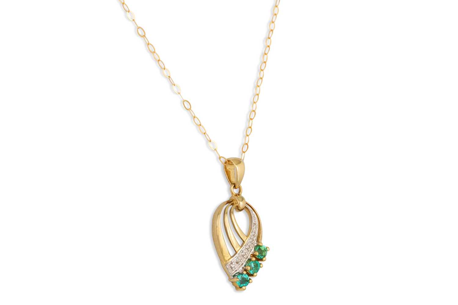 Lot 63 - A DIAMOND AND EMERALD PENDANT, pear shaped...