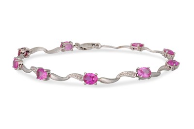 Lot 111 - A DIAMOND AND PINK SAPPHIRE BRACELET, the oval...