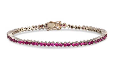 Lot 117 - A RUBY SET TENNIS BRACELET, mounted in 18ct...