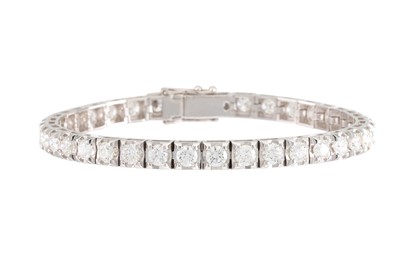 Lot 314 - A DIAMOND LINE BRACELET, the brilliant cut...