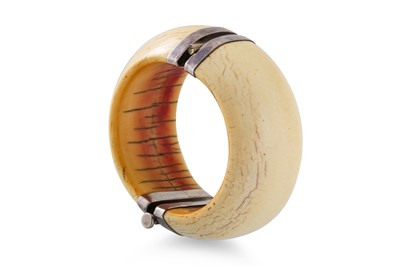 Lot 159 - AN ANTIQUE CARVED BANGLE, metal mounts