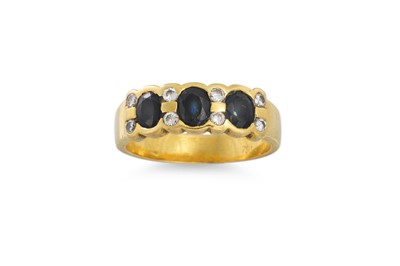 Lot 297 - A THREE STONE SAPPHIRE AND DIAMOND RING, the...