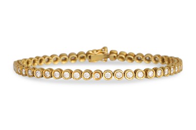 Lot 174 - A DIAMOND LINE BRACELET, the brilliant cut...