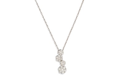 Lot 236 - A DIAMOND CLUSTER PENDANT, comprising four...