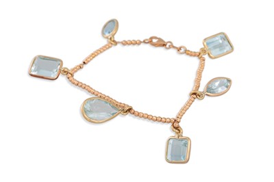 Lot 182 - AN AQUAMARINE CHARM BRACELET, comprising six...