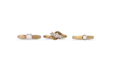 Lot 458 - THREE DIAMOND SET RINGS, all mounted in yellow...