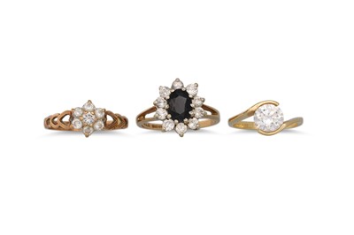 Lot 459 - THREE YELLOW GOLD RINGS, cubic zirconia set