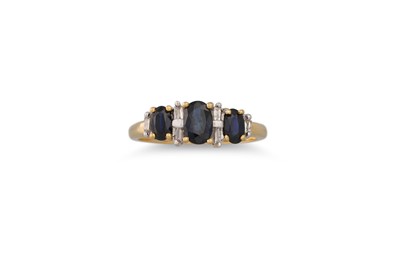 Lot 4 - A SAPPHIRE AND DIAMOND THREE STONE RING, set...