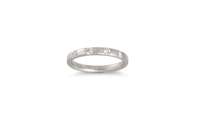 Lot 397 - A PLATINUM KEEPER RING, set with four...