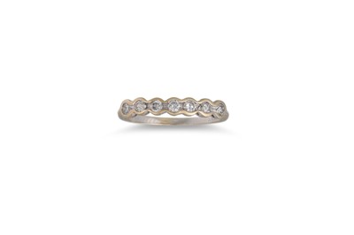 Lot 343 - A DIAMOND SEVEN STONE RING, the brilliant cut...
