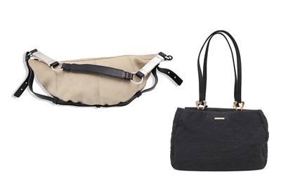 Lot 570 - TWO YVES SAINT LAURENT HANDBAGS, one suede and...