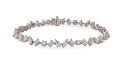 Lot 233 - A DIAMOND SET BRACELET, the round brilliant...