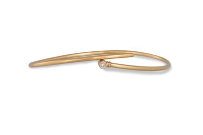 Lot 288 - A 14CT GOLD BANGLE, set with diamonds