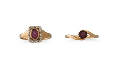 Lot 57 - A RUBY AND DIAMOND CLUSTER RING, the oval ruby...