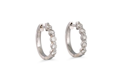 Lot 240 - A PAIR OF DIAMOND HOOP EARRINGS, the brilliant...