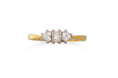Lot 146 - A THREE STONE DIAMOND RING, set with a...