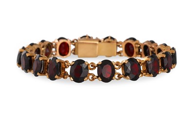 Lot 89 - A VINTAGE GARNET BRACELET, mounted in 9ct...