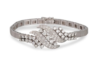 Lot 314 - A 1970s DIAMOND BRACELET, the centre spray...