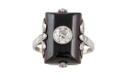 Lot 272 - AN ONYX AND DIAMOND PLAQUE RING, in a white...