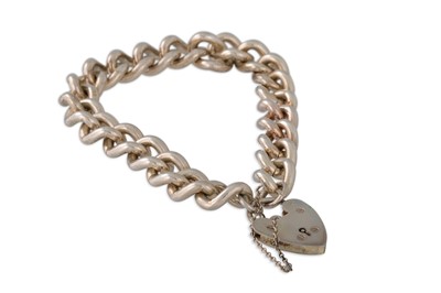 Lot 19 - A HEAVY SILVER FLAT CURB BRACELET, with...