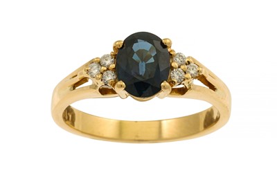 Lot 332 - A SAPPHIRE AND DIAMOND RING, the oval sapphire...