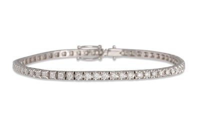Lot 213 - A DIAMOND LINE BRACELET, the brilliant cut...