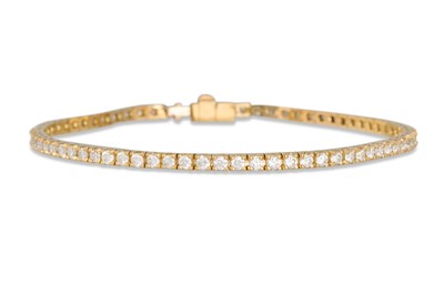 Lot 215 - A DIAMOND LINE BRACELET, the brilliant cut...