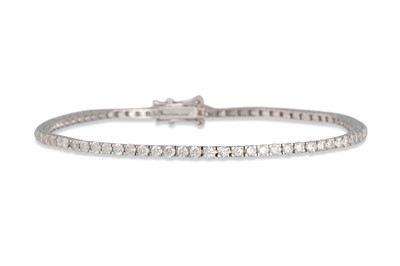 Lot 216 - A DIAMOND LINE BRACELET, the brilliant cut...