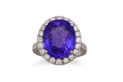 Lot 272 - A TANZANITE AND DIAMOND RING, the oval...