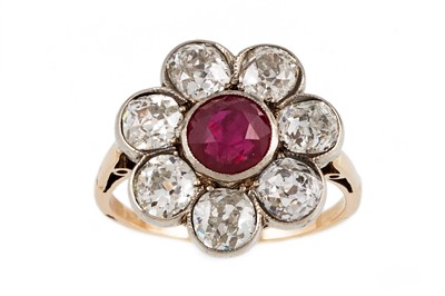 Lot 345 - A RUBY AND DIAMOND CLUSTER RING, the circular...