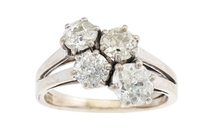 Lot 175 - A VINTAGE FOUR STONE DIAMOND RING, the four...