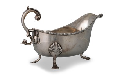 Lot 545 - A GEORGE III SILVER SAUCE BOAT, helmet shaped,...